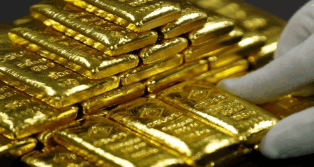 Gold reversed an early dip to weekly lows